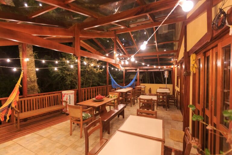 cozy backyard patio with comfortable seating and string lights - easy outdoor living spaces