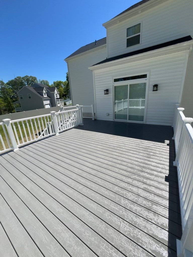 Gray composite deck with white railing and black balusters built by Cedar Creek Construction in the Lehigh Valley, PA