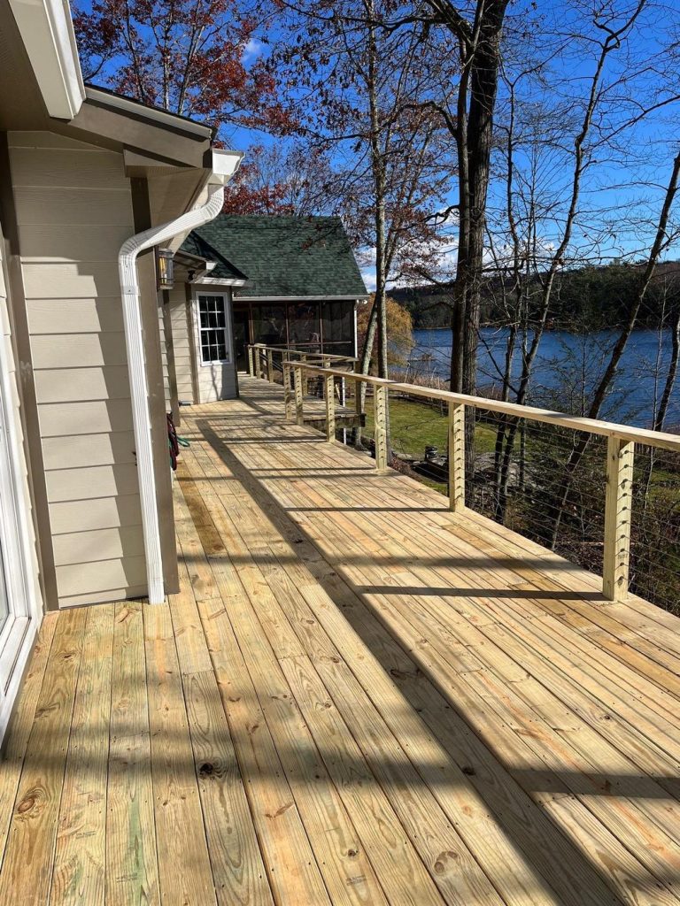 Lakeside pressure-treated wood deck and walkway built by Cedar Creek Construction