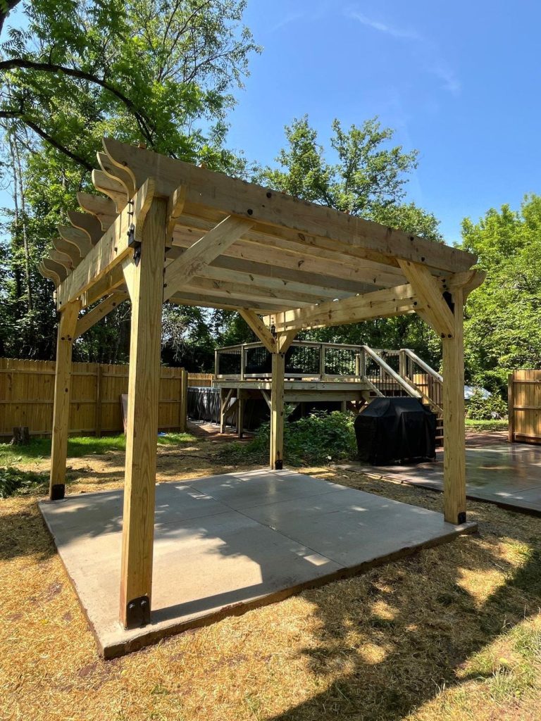 Pressure-treated wood pergola over a concrete patio built by Cedar Creek Construction in the Lehigh Valley, PA