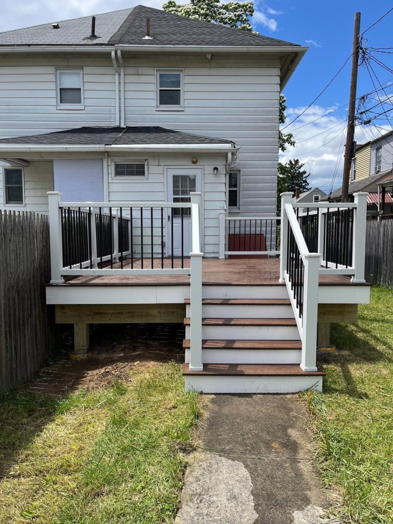 Rebuilt rear deck and stairs with new railing by Cedar Creek Construction in the Lehigh Valley, PA